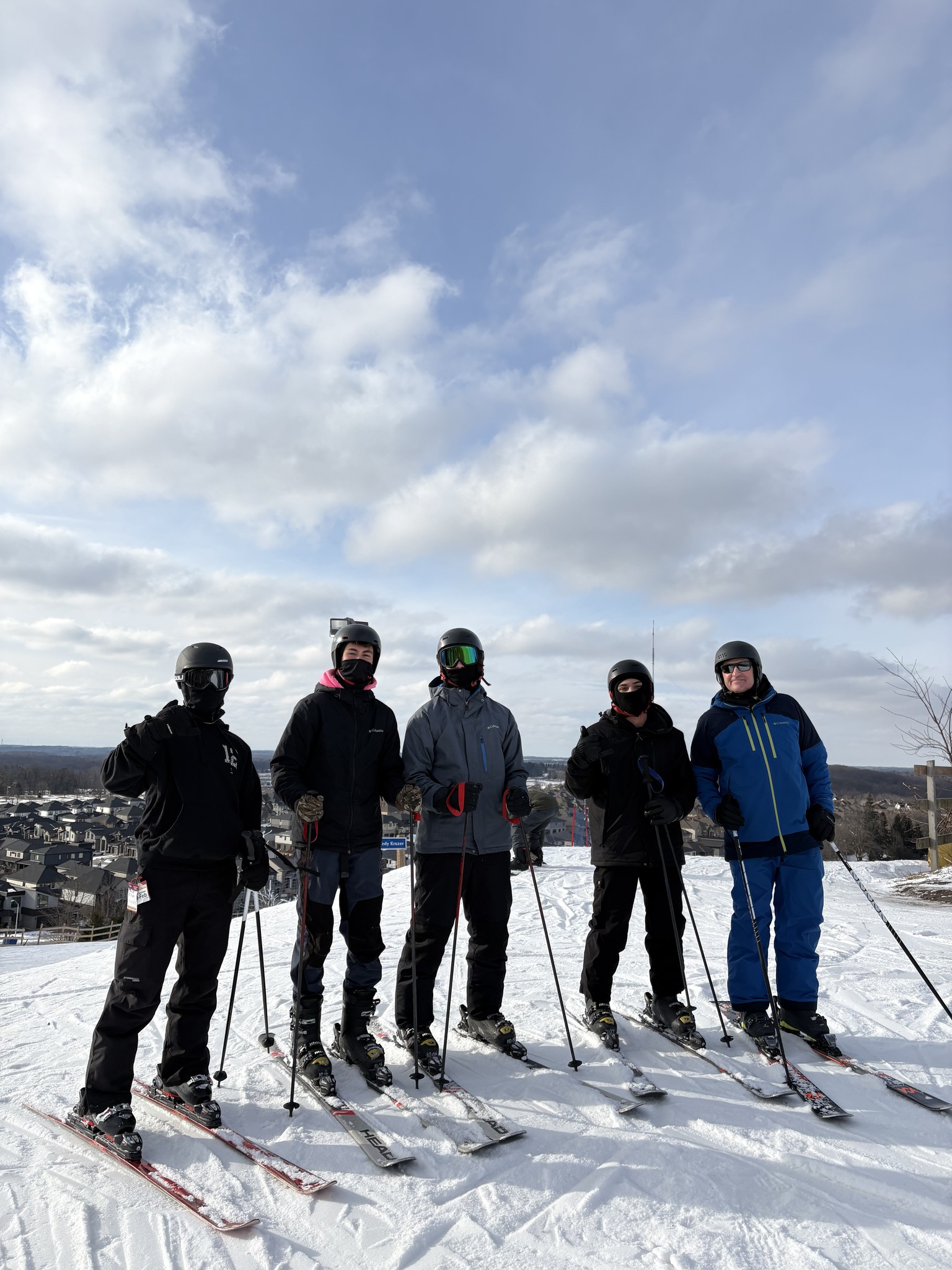 Youth group ski outing on a snowy hill